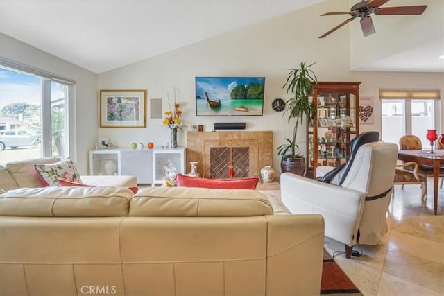 4433 E Justice Cir, Orange, CA 92869 - living room featuring light tile patterned floors, a high end fireplace, ceiling fan, and vaulted ceiling