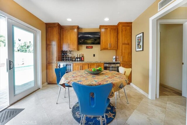 4433 E Justice Cir, Orange, CA 92869 - interior space with brown cabinets, visible vents, baseboards, wine cooler, and recessed lighting