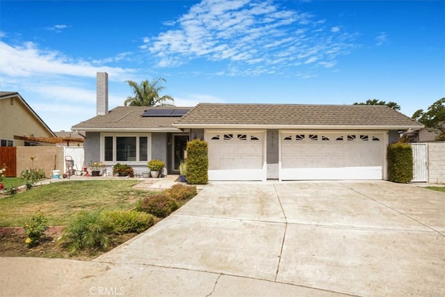 4433 E Justice Cir, Orange, CA 92869 - ranch-style home featuring stucco siding, fence, a front lawn, solar panels, and driveway