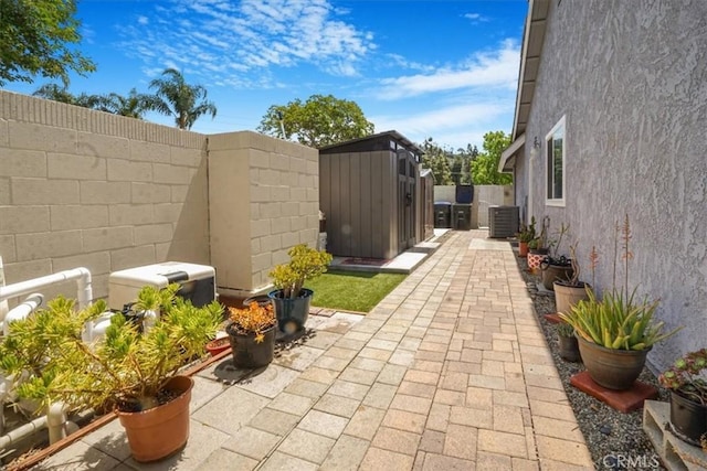 4433 E Justice Cir, Orange, CA 92869 - exterior space with cooling unit, an outdoor structure, a fenced backyard, and a storage unit