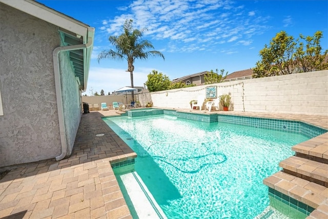 4433 E Justice Cir, Orange, CA 92869 - view of swimming pool with a patio area, a pool with connected hot tub, and a fenced backyard