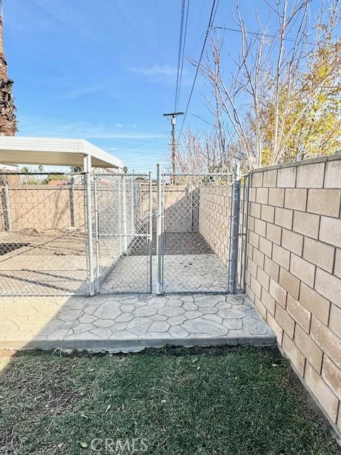 view of gate with fence