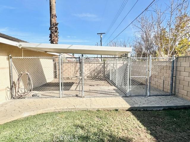 exterior space featuring a gate and fence
