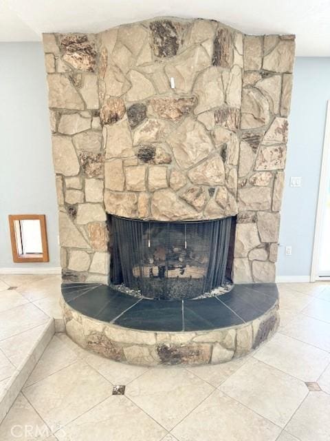 details with a fireplace and baseboards