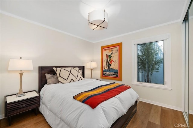 1614 Amelia Ave, San Pedro, CA 90731 - bedroom with baseboards, wood finished floors, and crown molding