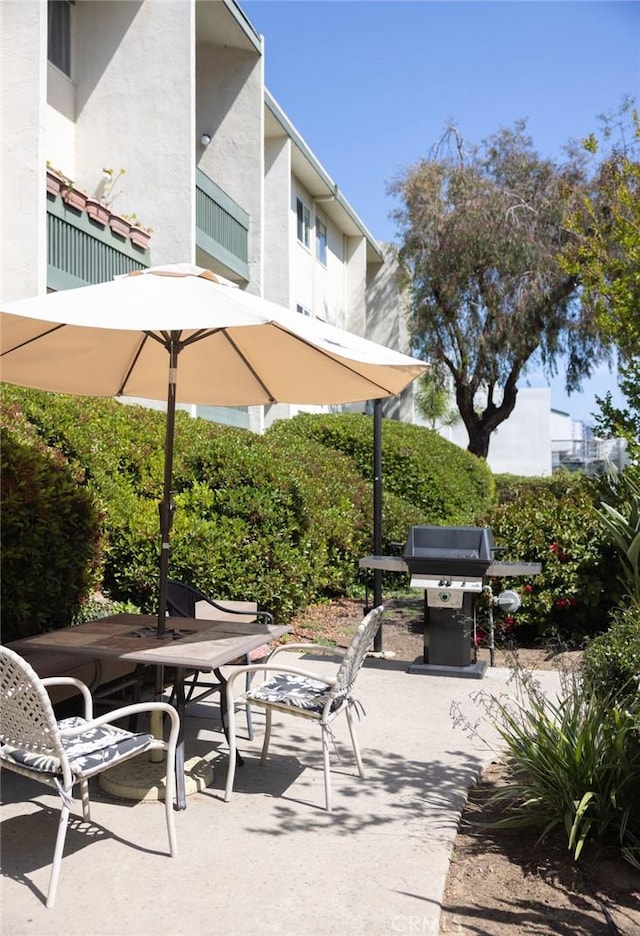view of patio / terrace with area for grilling and outdoor dining space