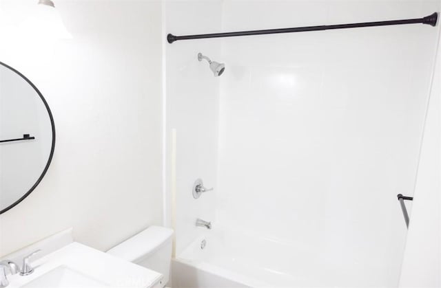 full bathroom featuring vanity, toilet, and  shower combination