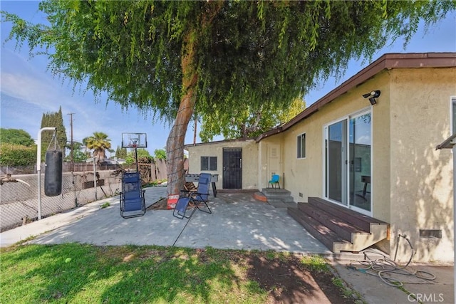 view of patio / terrace featuring fence and entry steps