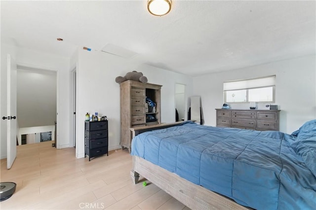 bedroom featuring wood finished floors
