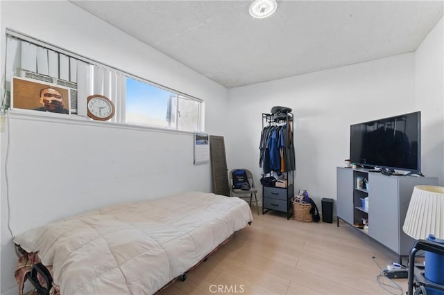 bedroom featuring wood finished floors