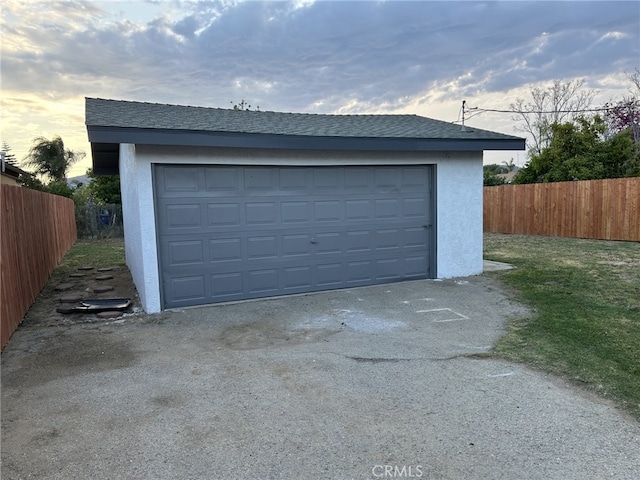 garage with fence