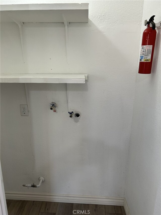 4832 Mitchell Ave, Riverside, CA 92505 - laundry room with wood finished floors and baseboards