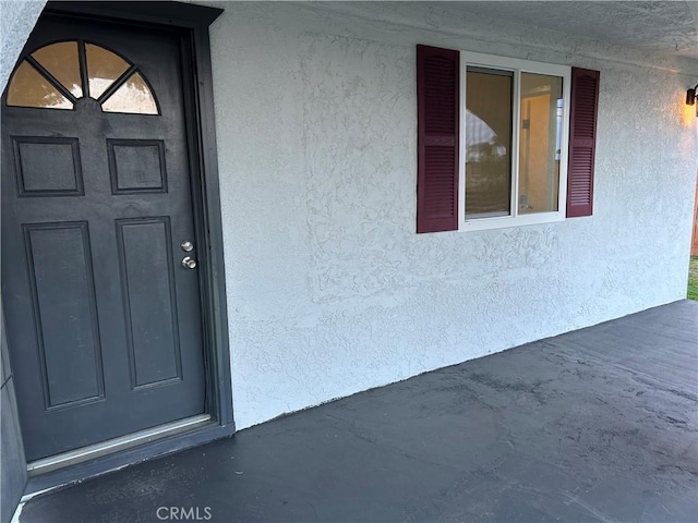 4832 Mitchell Ave, Riverside, CA 92505 - doorway to property featuring stucco siding