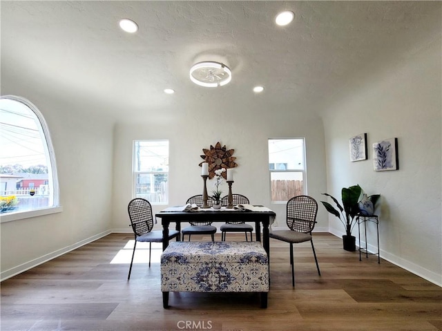 sitting room with baseboards, recessed lighting, and wood finished floors