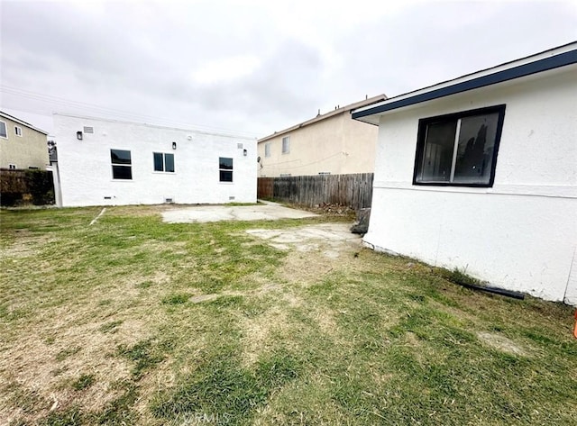 view of yard with fence and a patio area