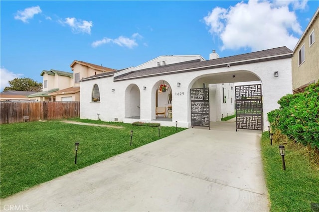 1629 E 114th St, Los Angeles, CA 90059 - back of house featuring stucco siding, driveway, and a shingled roof