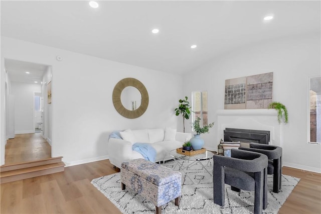 1629 E 114th St, Los Angeles, CA 90059 - living area featuring recessed lighting, wood finished floors, a fireplace, baseboards, and lofted ceiling