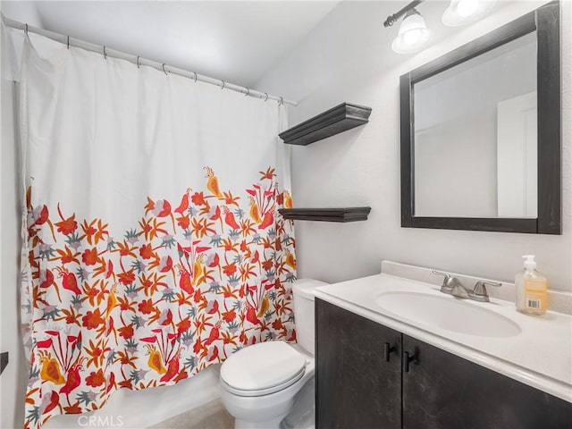 bathroom featuring toilet, curtained shower, and vanity