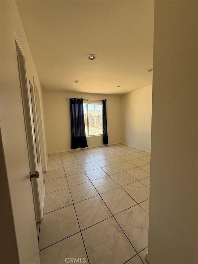 10434 Peach Ct, Adelanto, CA 92301 - spare room featuring light tile patterned floors and recessed lighting