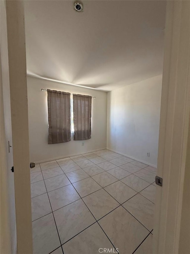 10434 Peach Ct, Adelanto, CA 92301 - unfurnished room featuring light tile patterned floors and baseboards