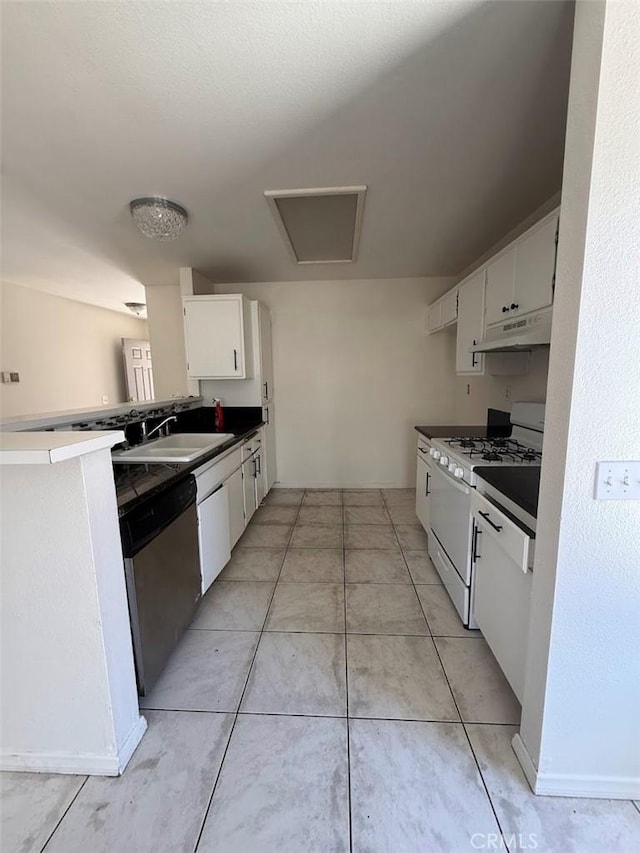 10434 Peach Ct, Adelanto, CA 92301 - kitchen with white gas range, under cabinet range hood, dishwasher, white cabinets, and light tile patterned floors