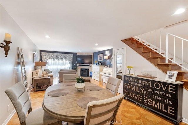 dining space with stairs, recessed lighting, and baseboards