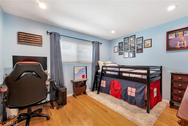 bedroom featuring recessed lighting, baseboards, and wood finished floors