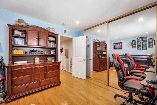 office featuring recessed lighting, visible vents, and light wood-style flooring