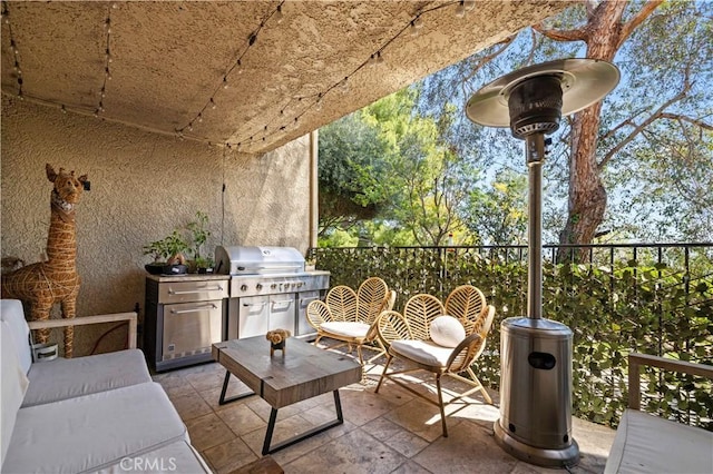 view of patio featuring exterior kitchen and grilling area