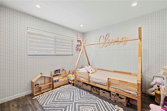 bedroom with recessed lighting, wallpapered walls, and wood finished floors