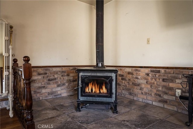 1411 Sequoia Dr, Lake Arrowhead, CA 92352 - interior details featuring a wood stove and wainscoting