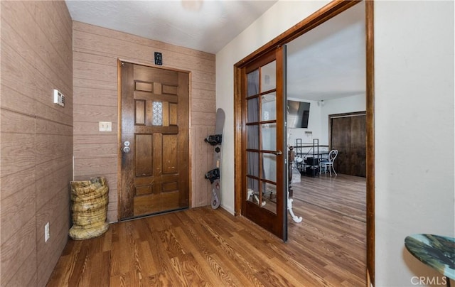 1411 Sequoia Dr, Lake Arrowhead, CA 92352 - entryway with arched walkways, wood walls, and wood finished floors
