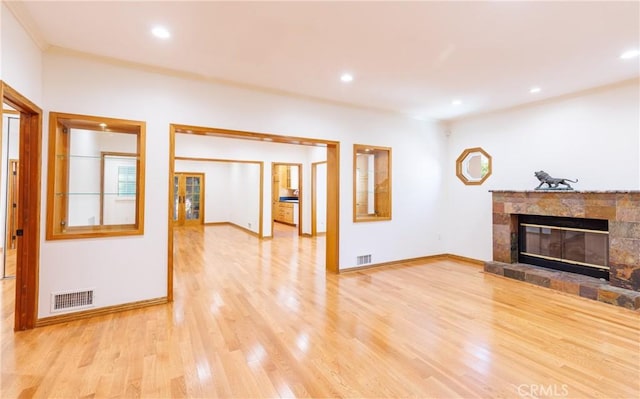unfurnished living room with recessed lighting, visible vents, and light wood-style floors