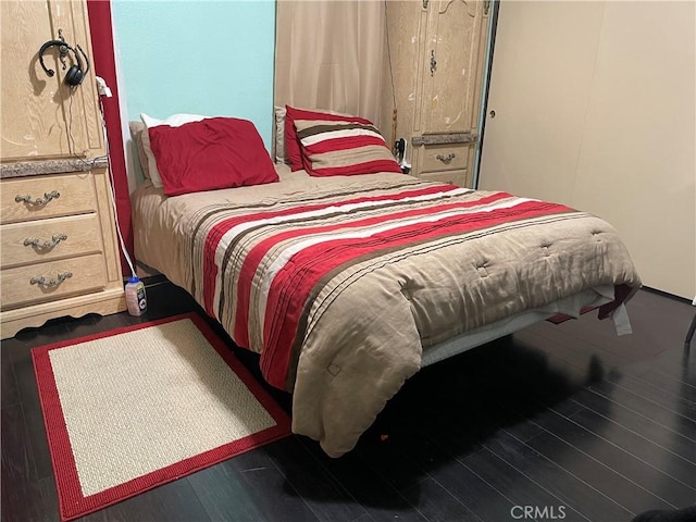 bedroom featuring wood finished floors