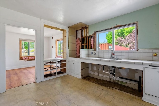 9235 Poplar St, Atascadero, CA 93422 - kitchen featuring a sink, tasteful backsplash, and tile countertops