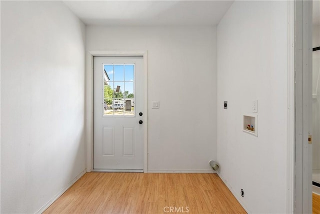 9235 Poplar St, Atascadero, CA 93422 - washroom featuring electric dryer hookup, hookup for a washing machine, light wood-style flooring, and baseboards