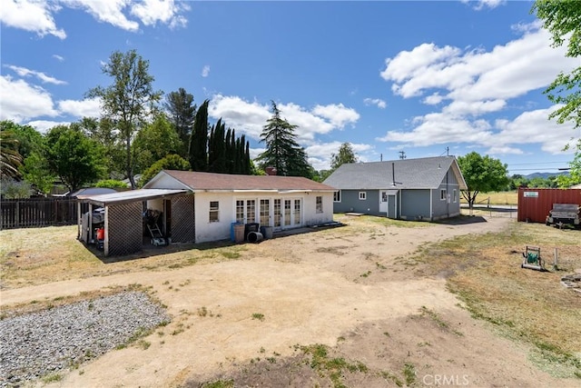 9235 Poplar St, Atascadero, CA 93422 - back of property featuring dirt driveway and a carport