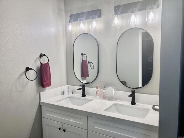 full bath with a sink and double vanity