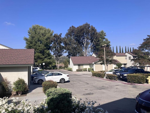view of road featuring street lighting and a residential view