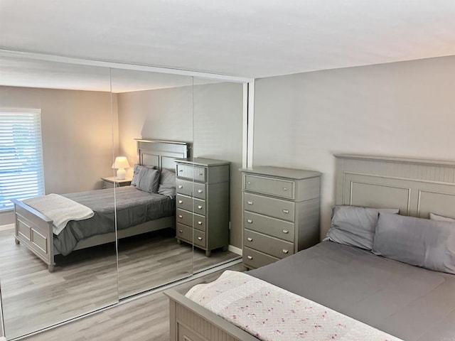bedroom with light wood-style floors