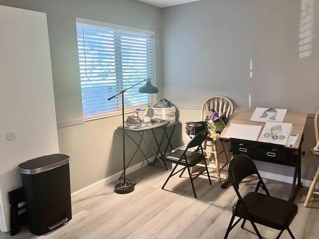 home office featuring baseboards and wood finished floors