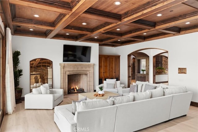 18441 Calle Tramonto, Rancho Santa Fe, CA 92091 - living room featuring arched walkways, beamed ceiling, coffered ceiling, light wood-style floors, and recessed lighting