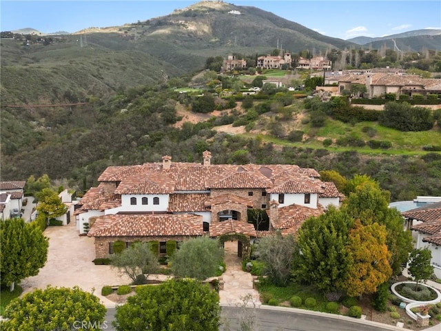 drone / aerial view with a residential view and a mountain view