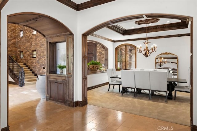 18441 Calle Tramonto, Rancho Santa Fe, CA 92091 - dining space featuring a chandelier, arched walkways, crown molding, light colored carpet, and baseboards