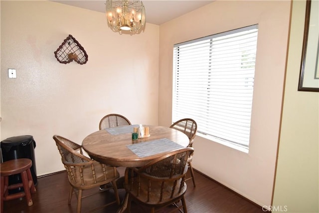 5727 E Stillwater Ave Unit 5, Orange, CA 92869 - dining room featuring an inviting chandelier and wood finished floors