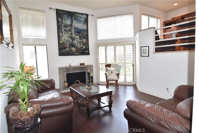 5727 E Stillwater Ave Unit 5, Orange, CA 92869 - living area with plenty of natural light, a fireplace with raised hearth, recessed lighting, and wood finished floors