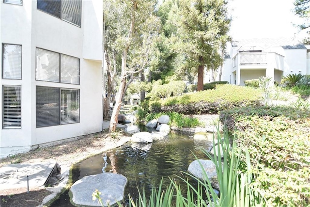 5727 E Stillwater Ave Unit 5, Orange, CA 92869 - view of yard with a garden pond