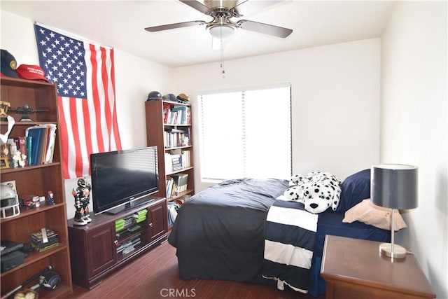 5727 E Stillwater Ave Unit 5, Orange, CA 92869 - bedroom with a ceiling fan and dark wood-style floors