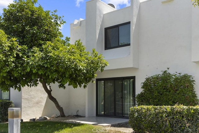 48668 Desert Flower Dr, Palm Desert, CA 92260 - back of house with stucco siding