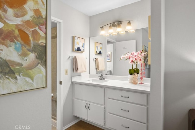 full bath featuring wood finished floors and vanity